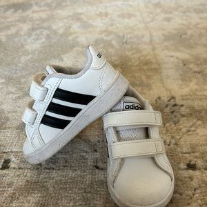 Toddler white adidas with black stripes